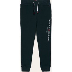 Tommy Hilfiger - Spodnie dziecięce 128-176 cm. Niebieskie dresy chłopięce TOMMY HILFIGER, z aplikacjami, z elastanu. Za 269,90 zł.