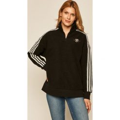 Adidas Originals - Bluza. Czarne bluzy damskie adidas Originals, m, z aplikacjami, z elastanu, z krótkim rękawem, krótkie, bez kaptura. W wyprzedaży za 239,90 zł.