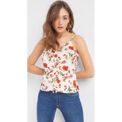 Top w kwiaty z baskinką. Brązowe koszulki damskie Orsay, s, w kwiaty, z elastanu, bez kołnierzyka, bez rękawów. Za 49,99 zł.