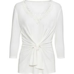 Shirt z przewiązaniem i koronką bonprix biel wełny. Białe koszulki damskie bonprix, w paski, z wełny, bez kołnierzyka, bez rękawów. Za 37,99 zł.