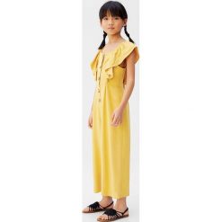 Mango Kids - Kombinezon dziecięcy Laurel 110-164 cm. Żółte kombinezony dziewczęce Mango Kids, bez wzorów, z wiskozy, z krótkim rękawem, krótkie. W wyprzedaży za 103,90 zł.