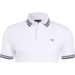 Emporio Armani Koszulka polo bianco ottico. Białe koszulki polo męskie Emporio Armani, s, bez wzorów, z elastanu, polo, bez rękawów. W wyprzedaży za 367,20 zł.