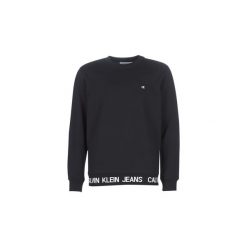 Bluzy Calvin Klein Jeans INSTIT LOGO WAISTBAND CN. Czarne bluzy męskie Calvin Klein Jeans, s, bez wzorów, z jeansu, bez kołnierzyka, bez rękawów, bez kaptura. Za 440,10 zł.