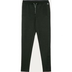 Calvin Klein Jeans - Spodnie dziecięce 140-176 cm. Czarne spodnie dziewczęce Calvin Klein Jeans, bez wzorów, z elastanu. Za 299,90 zł.