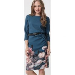Ciemnozielona Sukienka Bellfield. Zielone sukienki damskie Born2be, na imprezę, xl, z nadrukiem, z dzianiny, klasyczne, z okrągłym kołnierzem, bez rękawów, midi. Za 79,99 zł.