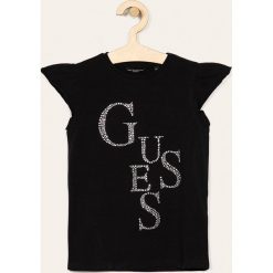 Guess Jeans - T-shirt dziecięcy 118-175 cm. Czarne bluzki dziewczęce Guess Jeans, z aplikacjami, z elastanu, z okrągłym kołnierzem, z krótkim rękawem, krótkie, bez kaptura. Za 99,90 zł.