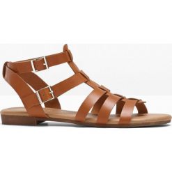 Sandały bonprix koniakowy. Pomarańczowe sandały damskie bonprix, w paski, bez obcasa, z paskami. Za 79,99 zł.