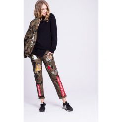 Naoko - Spodnie Wild Soul X Edyta Górniak. Szare spodnie damskie marki NAOKO, s, z bawełny. W wyprzedaży za 129,90 zł.