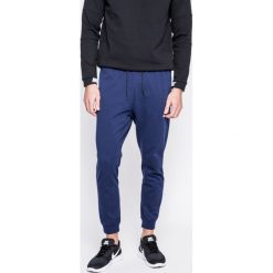 Nike Sportswear - Spodnie. Niebieskie joggery męskie marki Nike Sportswear, z bawełny. W wyprzedaży za 159,90 zł.