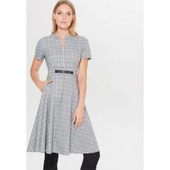 Midi sukienka w kratę - Turkusowy. Niebieskie sukienki damskie Mohito, bez wzorów, bez kołnierzyka, bez rękawów, midi. Za 169,99 zł.