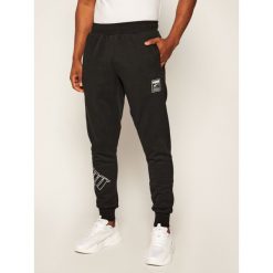 Spodnie dresowe Puma Rebel Bold 583789. Czarne jeansy męskie Puma, s, bez wzorów. Za 199,99 zł.