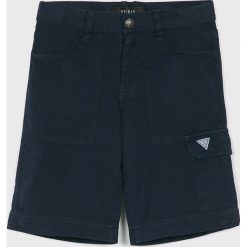 Guess Jeans - Szorty dziecięce 118-175 cm. Niebieskie spodenki chłopięce z aplikacjami, z bawełny, casualowe. W wyprzedaży za 129,90 zł.
