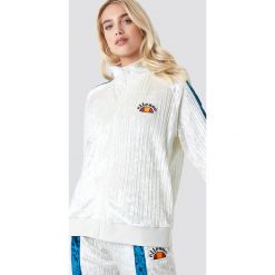 Ellesse El Angelica Velvet Track Top - White. Białe topy damskie marki Ellesse, z aplikacjami, bez kołnierzyka. Za 404,95 zł.