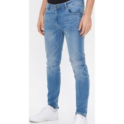 Jeansy skinny z bawełny z recyklingu - Niebieski. Niebieskie jeansy męskie House, m, bez wzorów. Za 119,99 zł.