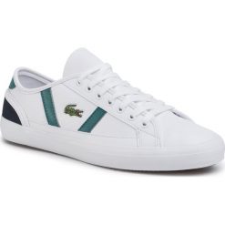 Tenisówki LACOSTE - Sideline 120 5 Cma 7-39CMA0073042 Wht/Nvy. Białe półbuty męskie Lacoste, na co dzień, bez wzorów, z gumy, eleganckie, bez zapięcia. Za 399,00 zł.