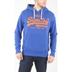 SuperDry Bluza Niebieski. Niebieskie bluzy męskie Superdry, xl, z nadrukiem, z bawełny, bez kołnierzyka, bez rękawów, bez kaptura. Za 395,95 zł.