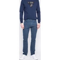 Guess Jeans - Jeansy. Niebieskie jeansy męskie marki Guess Jeans, s, z aplikacjami, z podwyższonym stanem. W wyprzedaży za 199,90 zł.