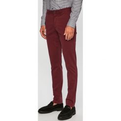 Tommy Hilfiger - Spodnie. Brązowe spodnie męskie TOMMY HILFIGER, bez wzorów, z elastanu. W wyprzedaży za 199,90 zł.
