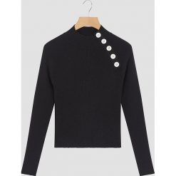 Sweter w kolorze czarnym. Czarne swetry damskie Rodier, bez wzorów, prążkowane, klasyczne, bez rękawów, bez kaptura. W wyprzedaży za 172,95 zł.