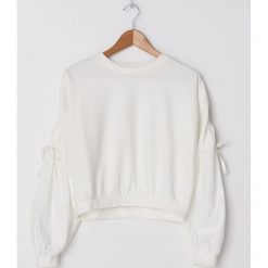 Bluza z bufiastymi rękawami - Kremowy. Białe bluzy damskie House, s, bez wzorów, bez rękawów, bez kaptura. W wyprzedaży za 49,99 zł.