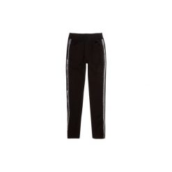 Spodnie dziewczęce z lampasami legginsy. Czarne legginsy dziewczęce TXM. Za 24,99 zł.