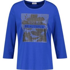 Koszulka w kolorze niebieskim. Niebieskie koszulki damskie Gerry Weber, bez wzorów, z okrągłym kołnierzem, bez rękawów. W wyprzedaży za 69,95 zł.
