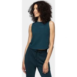 Top damski. Topy damskie s, bez wzorów, z bawełny, bez kołnierzyka. W wyprzedaży za 29,99 zł.