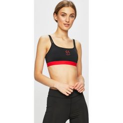 Calvin Klein Performance - Biustonosz. Czarne biustonosze sportowe damskie Calvin Klein Performance, xs, bez wzorów, z elastanu. W wyprzedaży za 89,90 zł.