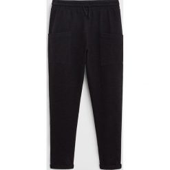 Mango Kids - Spodnie dziecięce Sluby 110-164 cm. Czarne spodnie dziewczęce Mango Kids, bez wzorów, z bawełny. Za 59,90 zł.