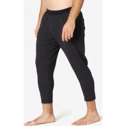 Spodnie dresowe 7/8 Gym & Pilates 900 męskie. Czarne spodnie męskie NYAMBA, s, bez wzorów, z elastanu. Za 109,99 zł.