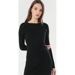 Czarny Sweter Charrahne. Czarne swetry damskie Born2be, s, bez wzorów, bez rękawów, bez kaptura. Za 99,99 zł.