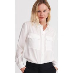 Koszula z modalu - Kremowy. Białe koszule damskie Reserved, bez wzorów, bez kołnierzyka, bez rękawów. Za 139,99 zł.