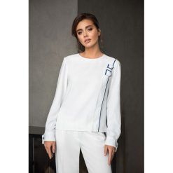 Damska Bluzka z Lamówką i Kokardą Biel. Białe bluzki damskie Veva, z aplikacjami, eleganckie, z kokardą. Za 139,00 zł.