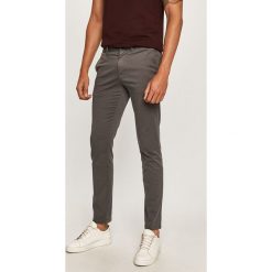 Tommy Hilfiger - Spodnie. Szare spodnie męskie TOMMY HILFIGER, na co dzień, bez wzorów, z elastanu. Za 499,90 zł.