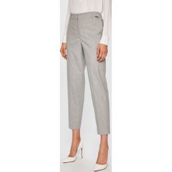 Calvin Klein - Spodnie. Szare spodnie damskie Calvin Klein, z haftami, z elastanu, casualowe. W wyprzedaży za 399,90 zł.