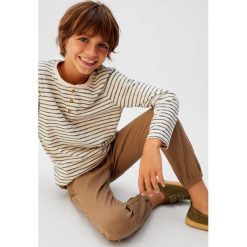 Mango Kids - Spodnie dziecięce Cord 110-164 cm. Spodnie chłopięce Mango Kids, bez wzorów, z elastanu, casualowe. Za 89,90 zł.