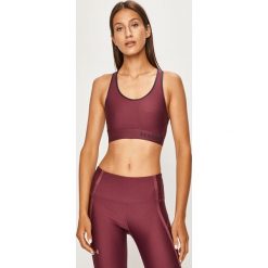 Under Armour - Biustonosz sportowy. Fioletowe biustonosze sportowe damskie Under Armour, xs, bez wzorów, z elastanu. W wyprzedaży za 89,90 zł.