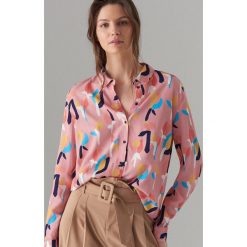 Koszula oversize we wzory - Różowy. Różowe koszule damskie Mohito, bez wzorów, bez kołnierzyka, bez rękawów. Za 119,99 zł.