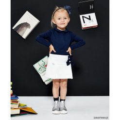 Spódniczka dla dziewczynki White Bows Skirt. Białe spódniczki dziewczęce marki Pakamera, z tkaniny, młodzieżowe. Za 129,00 zł.