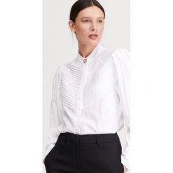 Bluzka z zakładkami - Kremowy. Białe bluzki damskie Reserved, bez wzorów, bez kołnierzyka, bez rękawów. Za 99,99 zł.