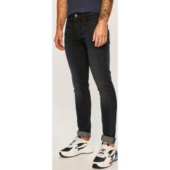 G-Star Raw - Jeansy 3301. Niebieskie jeansy męskie G-Star RAW, z aplikacjami, retro. W wyprzedaży za 279,90 zł.