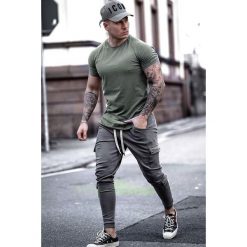 Męski t-shirt RINO. Zielone t-shirty męskie Męski t-shirt RINO, s, bez wzorów, bez kołnierzyka. W wyprzedaży za 39,00 zł.