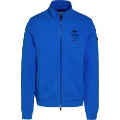 Bluza AERONAUTICA MILITARE. Niebieskie bluzy męskie Aeronautica Militare, z aplikacjami, z bawełny, bez kołnierzyka, bez rękawów, bez kaptura. Za 740,00 zł.