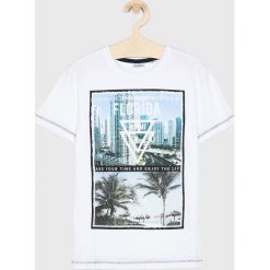 Blukids - T-shirt dziecięcy 140-170 cm. Białe t-shirty chłopięce Blukids, z nadrukiem, z bawełny, bez rękawów. W wyprzedaży za 29,90 zł.