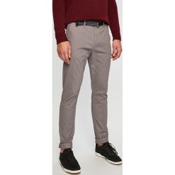 Scotch & Soda - Spodnie 150953. Niebieskie spodnie męskie Scotch & Soda, w paski, z elastanu. W wyprzedaży za 239,90 zł.