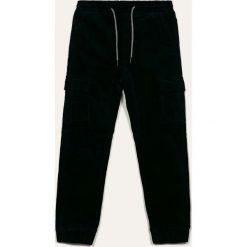Blukids - Spodnie dziecięce 98-134 cm. Niebieskie spodnie chłopięce Blukids, z elastanu, casualowe. W wyprzedaży za 59,90 zł.