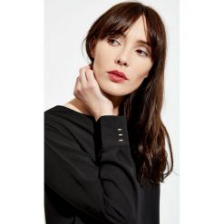 Bluzka koszulowa. Bluzki damskie Moodo, s, bez wzorów, z koszulowym kołnierzykiem, bez rękawów. Za 19,99 zł.