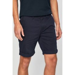 Tommy Jeans - Szorty. Niebieskie spodenki i szorty męskie Tommy Jeans, bez wzorów, z elastanu, casualowe. Za 299,90 zł.