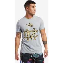 Reebok Combat Conor McGregor Koszulka Szary. Szare podkoszulki męskie Reebok, s, z haftami, z bawełny, bez kołnierzyka, krótkie. Za 111,95 zł.