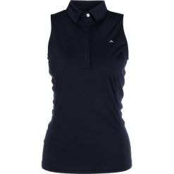 J.LINDEBERG DENA Koszulka sportowa navy. Niebieskie topy sportowe damskie marki J.LINDEBERG, xl, z poliesteru, polo. Za 299,00 zł.